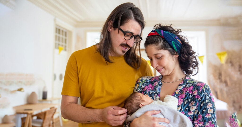 mother and father with newborn