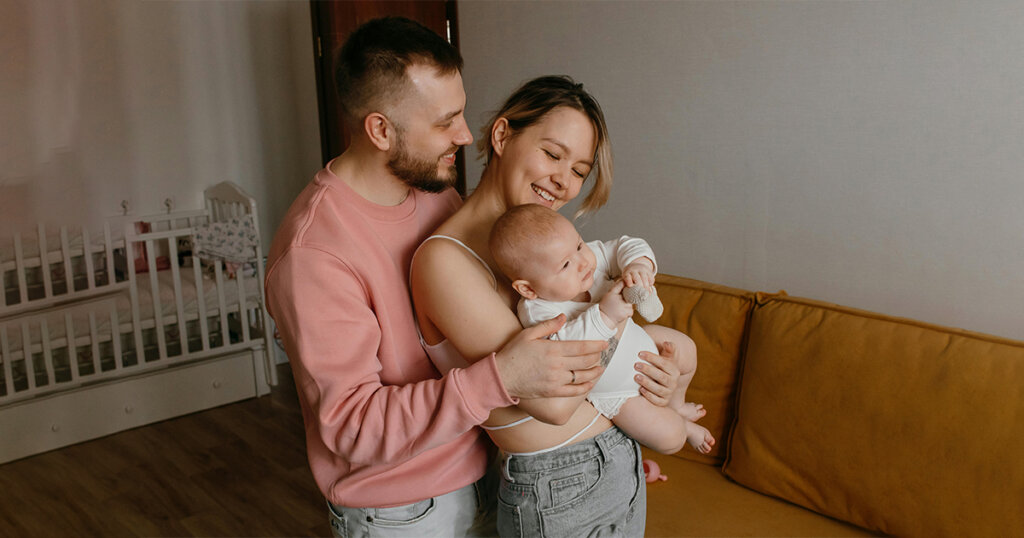 sweet couple with Newborn