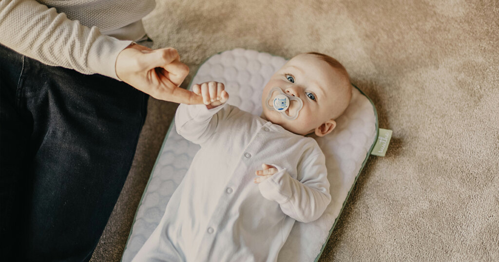 father's finger in baby hand