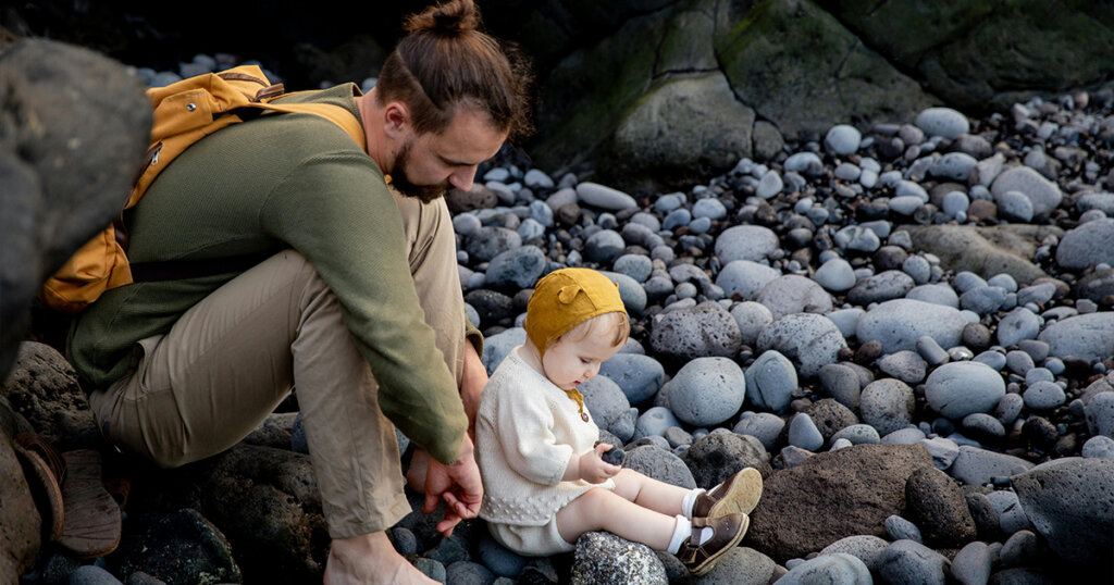 dad caring his baby while camping