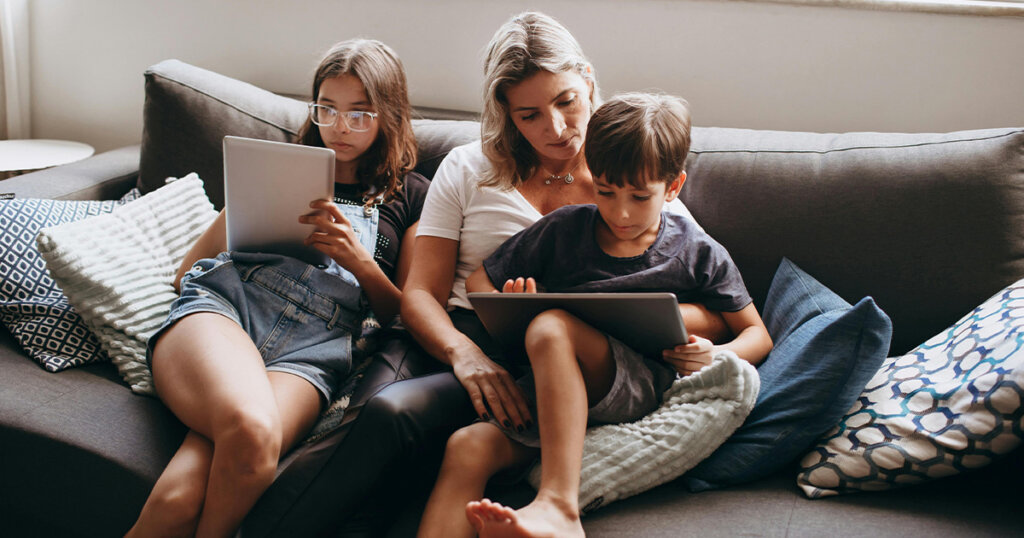 Mother and Children Sitting on Couch