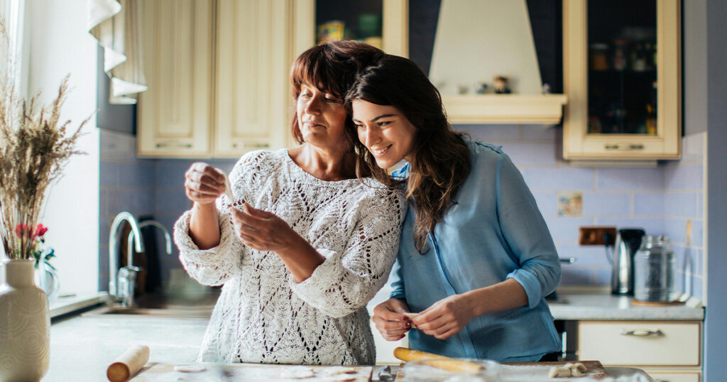 Woman In Blue Long Sleeve Shirt Beside Her Mother