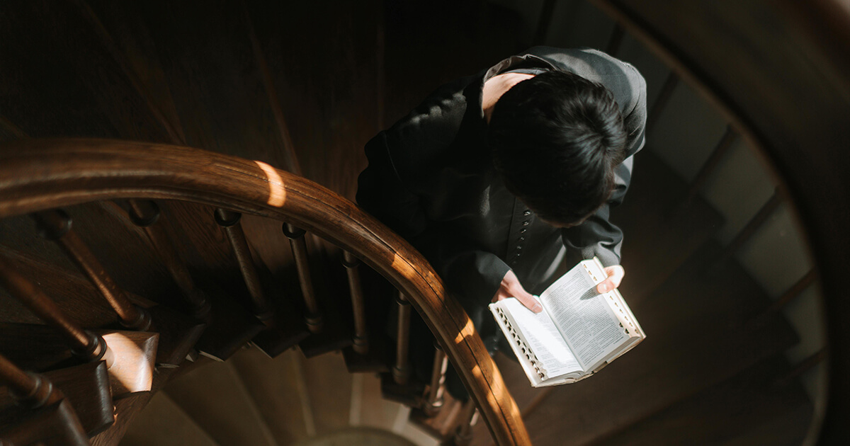 man reading Bible