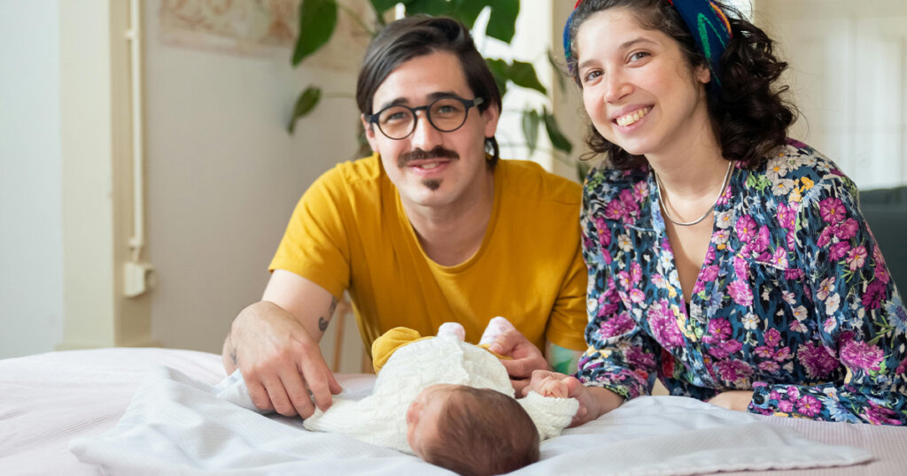 couple with child smiling