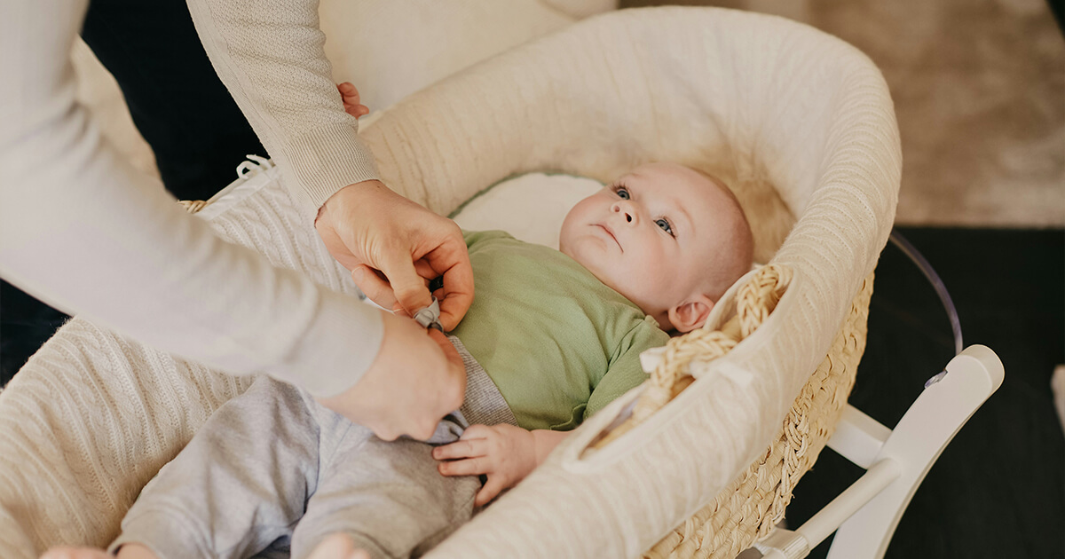 mom try to wake up baby from sleep