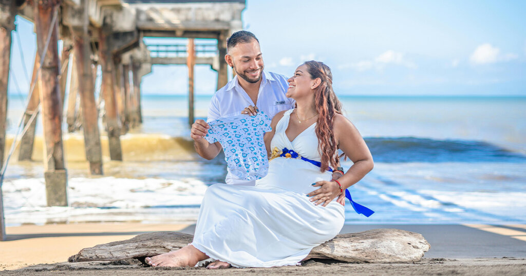 Photo of Pregnant Couple at the Beach