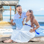 Photo of Pregnant Couple at the Beach