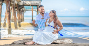 Photo of Pregnant Couple at the Beach