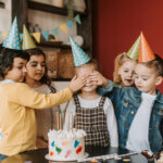 Photograph of Kids Covering a Girl's Eyes