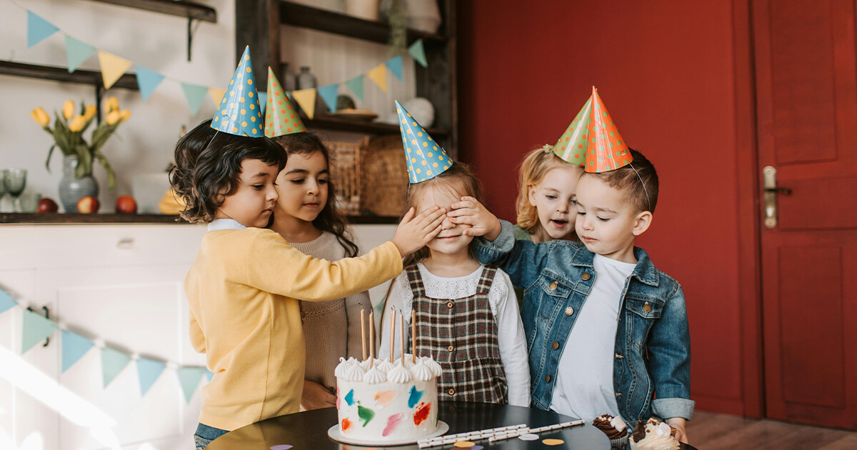 Photograph of Kids Covering a Girl's Eyes