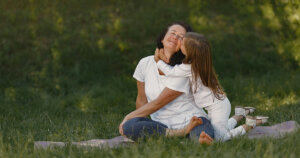 woman realizing her with little daughter in white dress