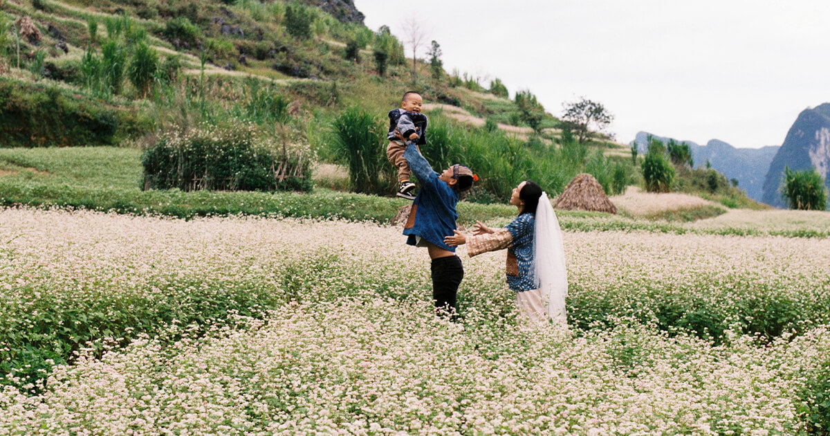 Parents with Their Child on a Field