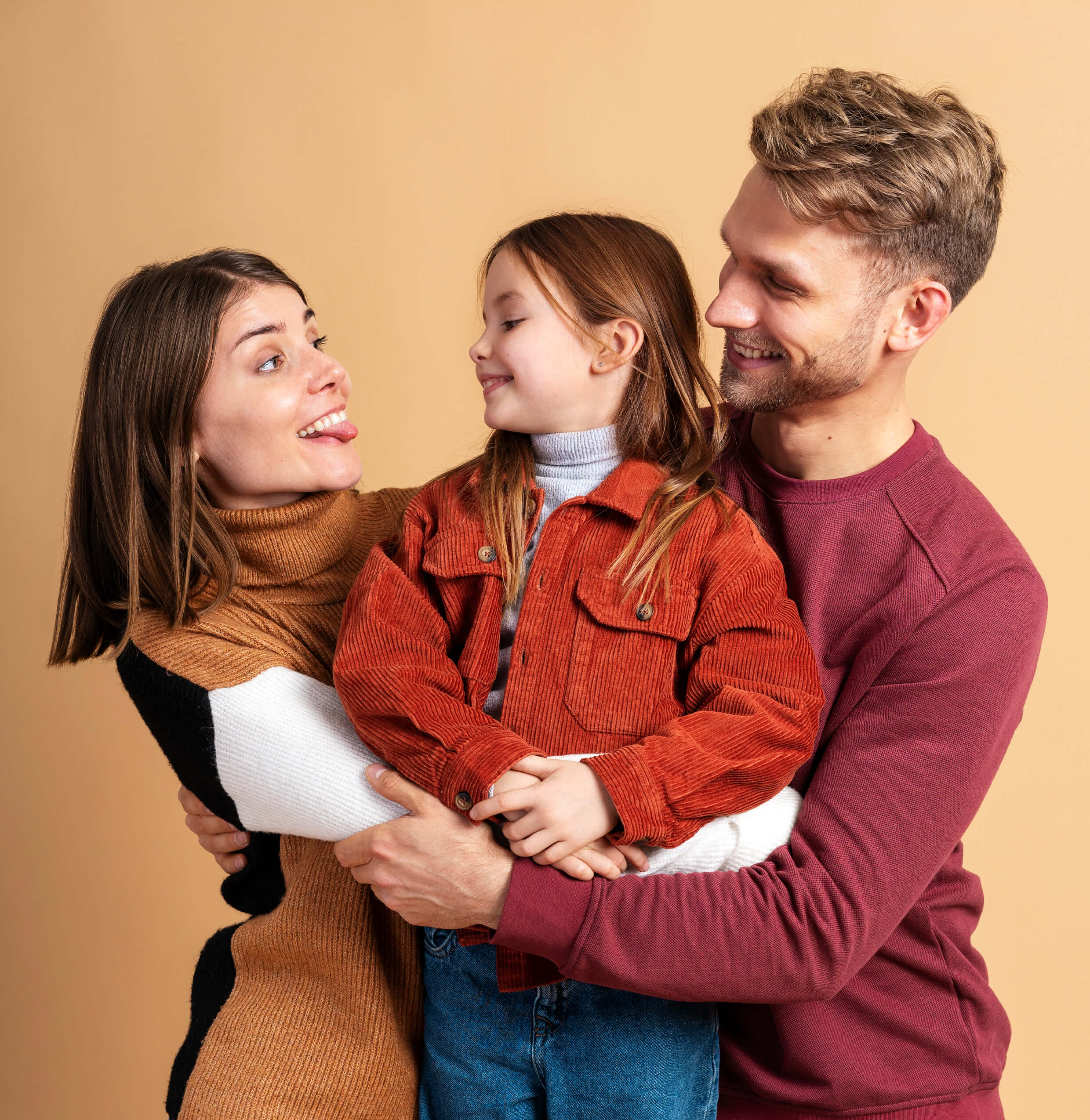 young-family-three-posing-together-before-traveling