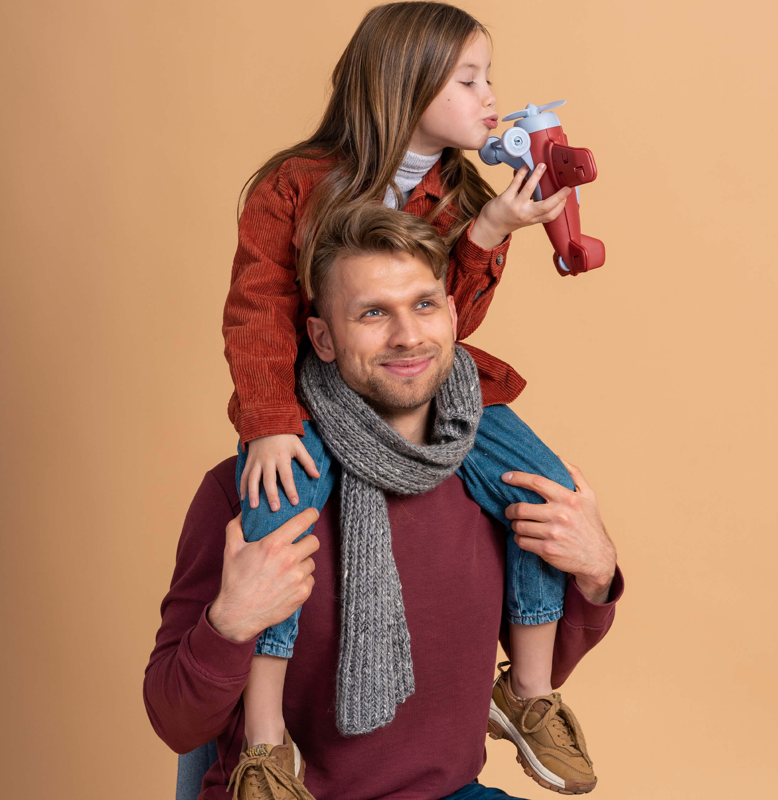 young-father-daughter-playing-together-before-traveling-with-toy-plane