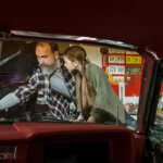 A Mechanic Teaching his Daughter How to Fix a Car