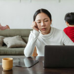 Kids making noise and disturbing mom working at home