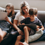 Mother and Children Sitting on Couch