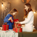 Mother and Daughter Opening Christmas Presents