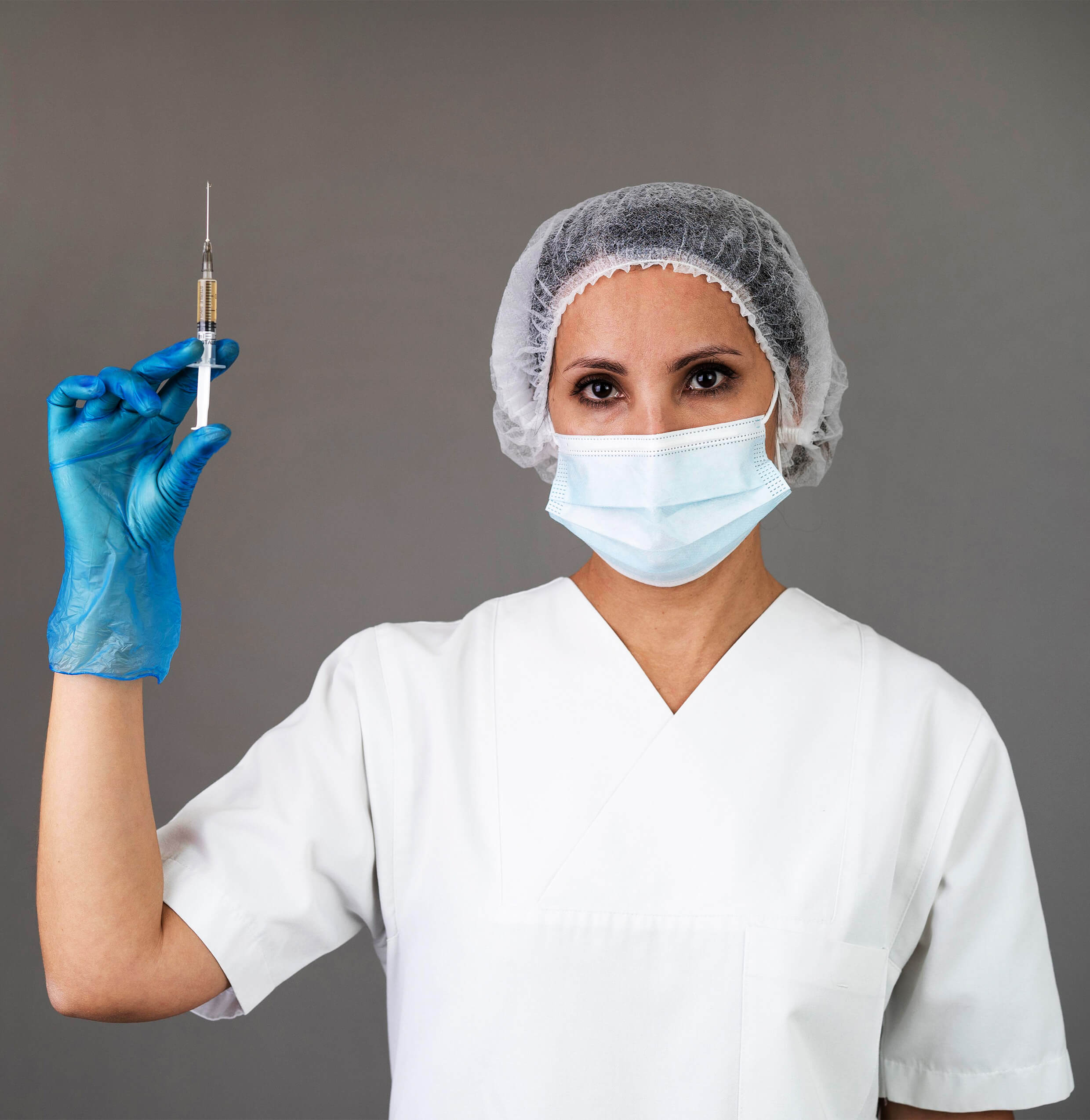 medium shot doctor with mask holding syringe