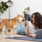 photo-of-woman-trying-work-with-her-dog-around