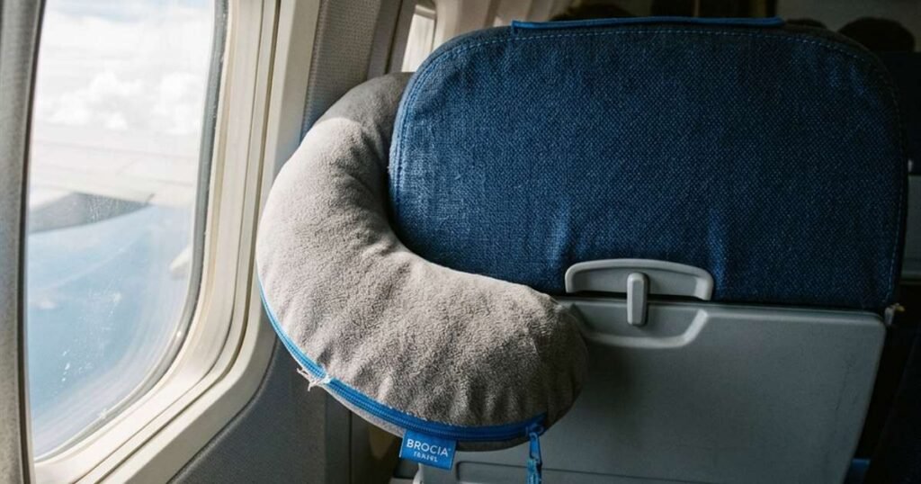 a-travel-pillow-resting-against-an-airplane-style-seat-headrest-showcasing-best-travel-pillows