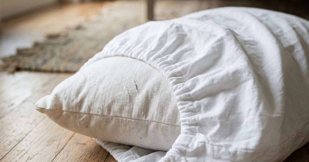 pillow-partially-inside-white-cotton-pillowcase-showcasing-standard-vs-super-standard-pillow
