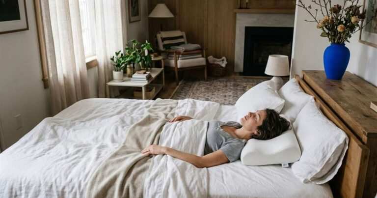 woman-waking-up-on-cervical-contour-pillow-showcasing-best-cervical-pillow-for-back-sleepers
