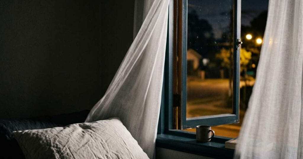 5 Best Cooling Pillows for Menopause Hot Flashes 3 Open bedroom window with a night breeze